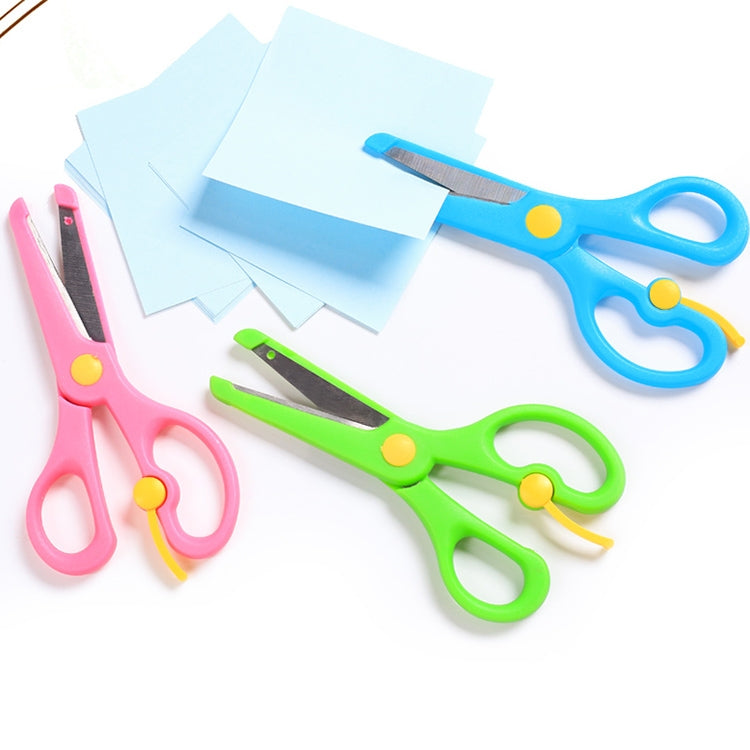 Set of pink, blue, green, and yellow safety scissors with elastic action and curved guards