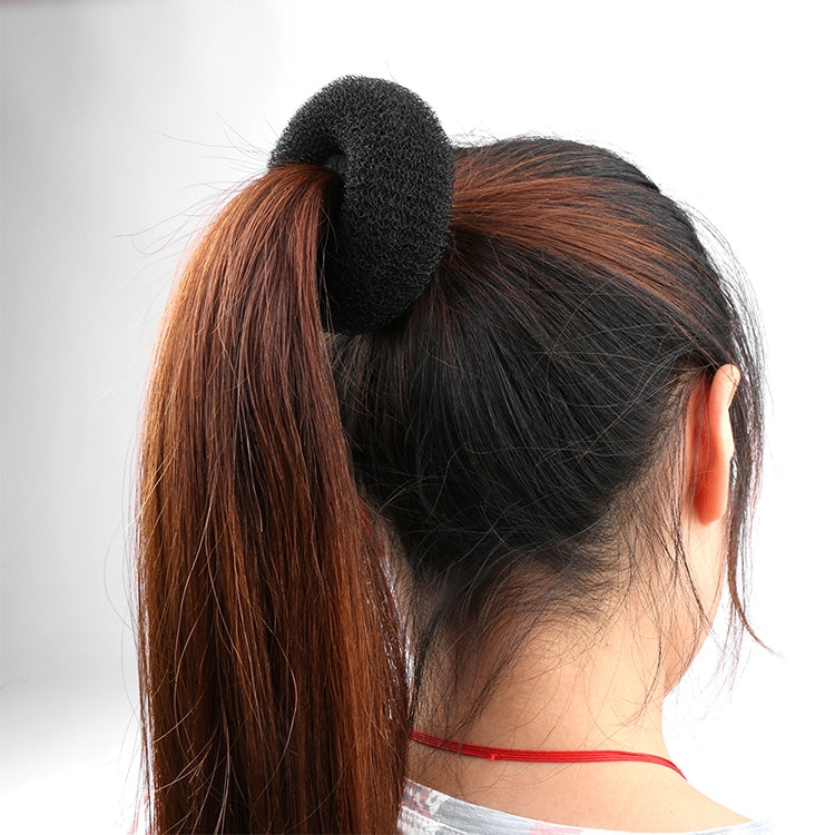 Black donut hair ring fitted to a high ponytail bun