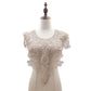 White lace fake collar with floral rosette center and scalloped shoulder trim.