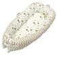 Baby nest bed with star print inner and tan chevron outer, cream base with bow ties