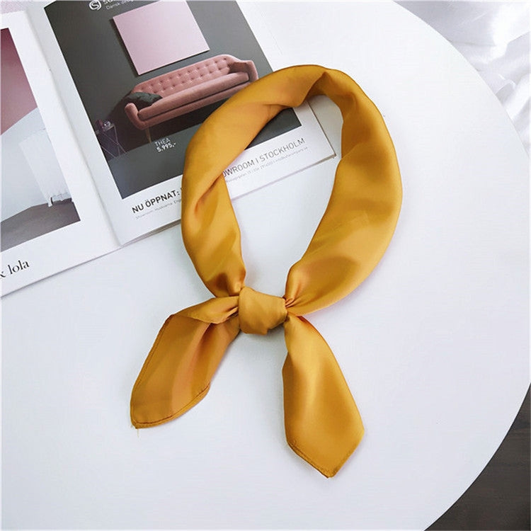 Solid-color satin square scarf with long tied bow, golden yellow