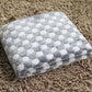 Flannel pet blanket with light gray and white dot pattern, plush fuzzy texture, folded