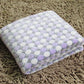 Flannel pet blanket with pastel lavender and pink dots, soft fuzzy top, folded