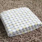 Flannel pet blanket with pastel yellow and white dot pattern, soft fuzzy top, folded