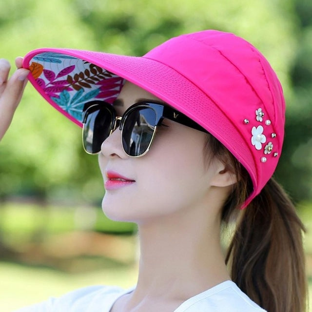 Women's wide-brim sun hat, hot pink with flower applique and colorful underside