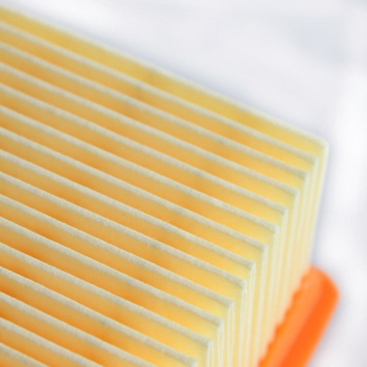 Close-up of yellow pleated filter media inside an orange filter frame