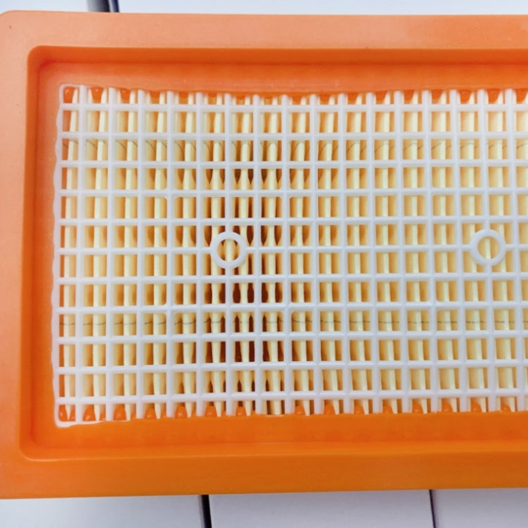 Orange plastic filter frame with white mesh grid, front view