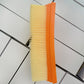 Vacuum filter element showing yellow pleats and orange side edge