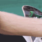 EVEBOT portable tattoo inkjet pen machine held against a forearm