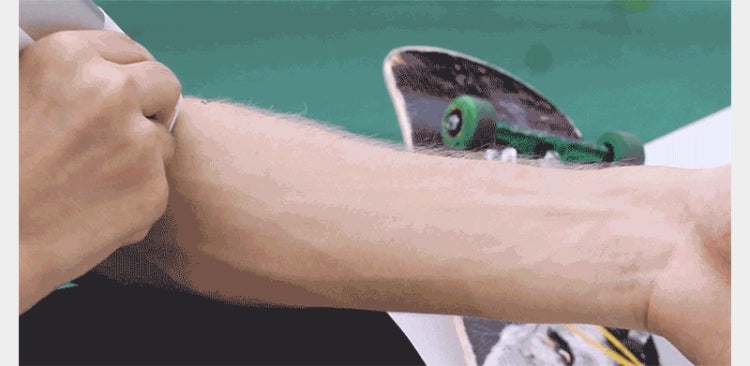 EVEBOT portable tattoo inkjet pen machine held against a forearm