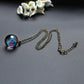 Gold-tone chain necklace with round galaxy glass globe pendant