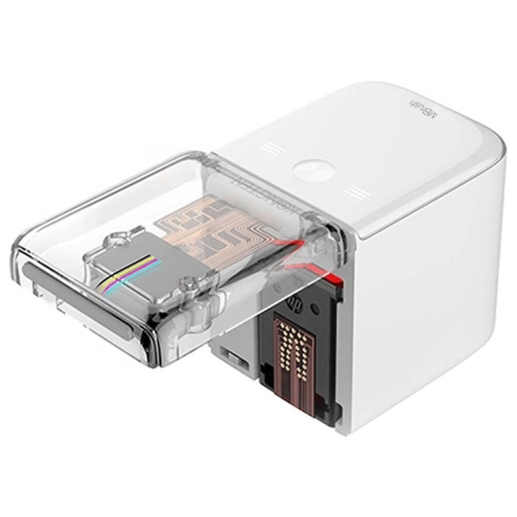 Handheld inkjet printer with open cartridge bay and visible ink cartridge, white