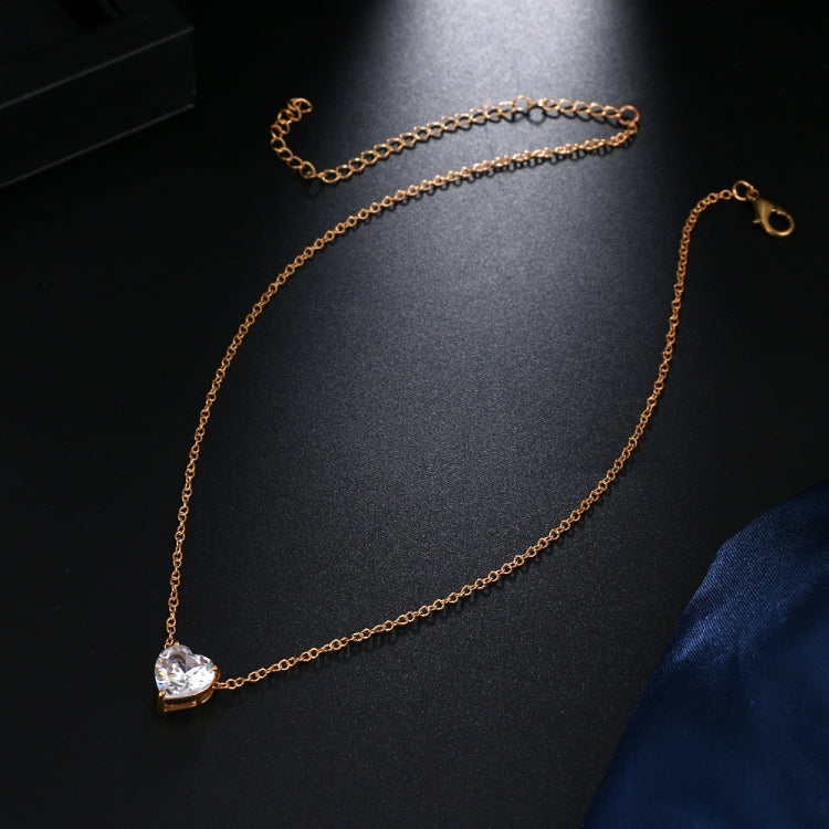 Gold-tone short necklace with heart-shaped crystal pendant