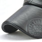 Black PU leather cap brim with embossed circular logo detail.