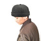 Dark gray retro flanged landlord hat worn by person, no eaves, rounded crown.