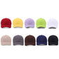 Assorted solid-color baseball caps in multiple colors, curved brims