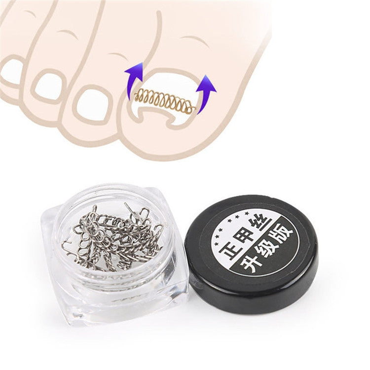 Toenail orthosis kit with silver curved metal clips in clear case and black lid