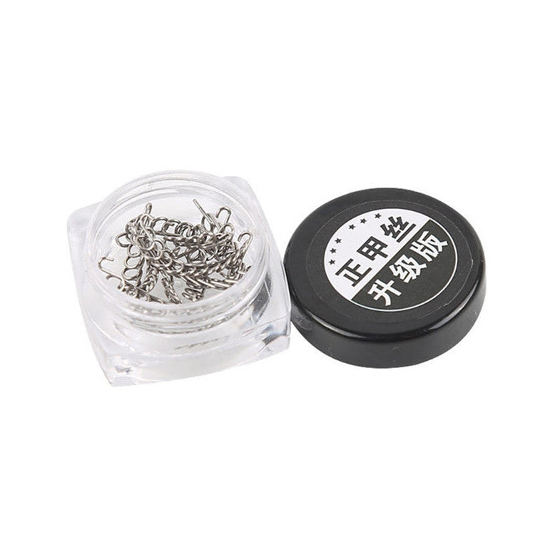 Toenail orthosis kit: clear container filled with silver metal clips and black cap