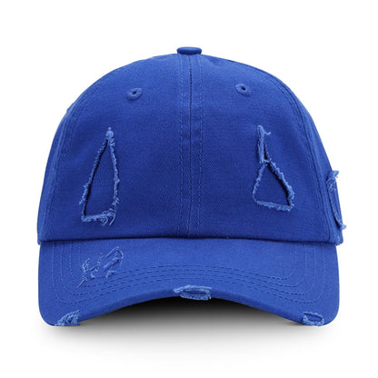 Washed blue baseball cap with distressed triangle applique and ripped brim
