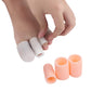 White and peach-orange toe caps for toe corn care, close-up