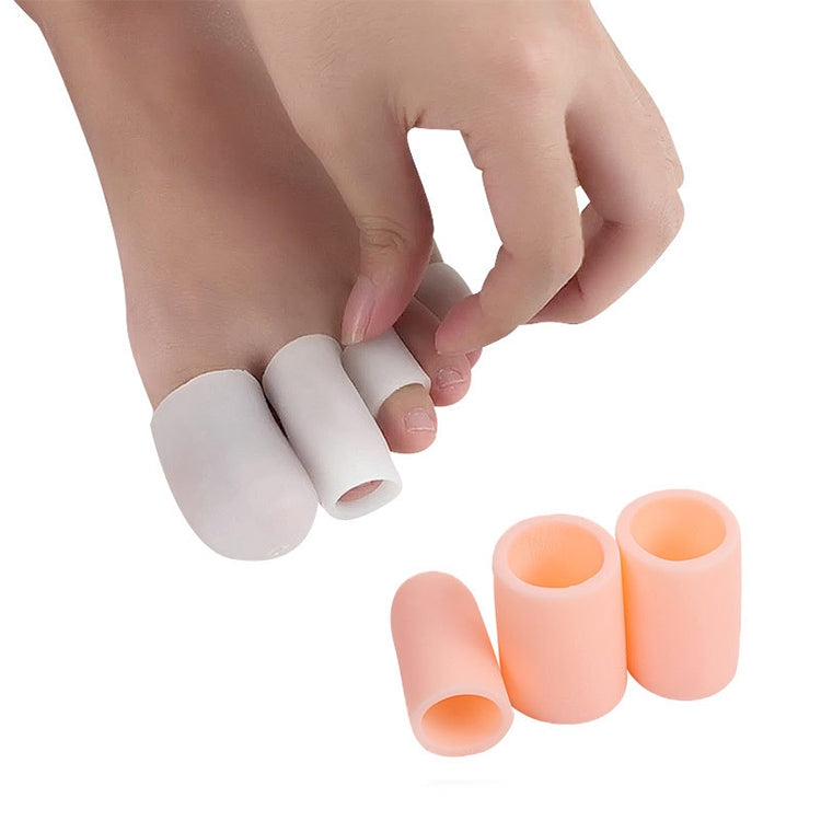 White and peach-orange toe caps for toe corn care, close-up