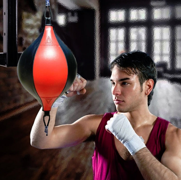 Hanging boxing speed ball, red center with black sides and top strap with chain