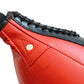 Boxing speed ball panel close-up, red leather with black trim and stitched seams
