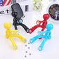 Set of 4 colorful humanoid magnet key hangers with metal keyrings attached.