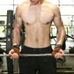 Brown suede wrist assist gloves with black straps worn while gripping a pull-up bar