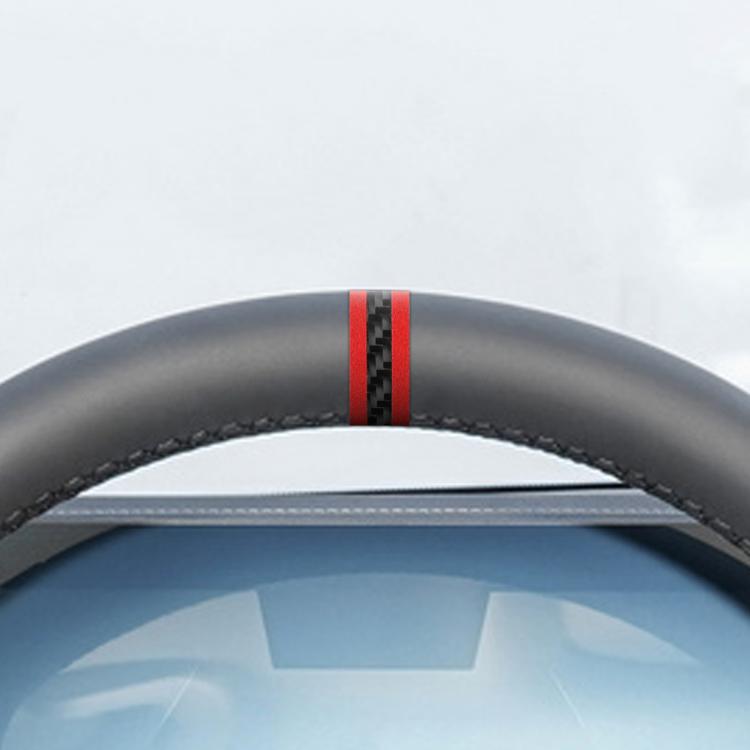 Close-up of steering wheel centering sticker showing two red accent stripes