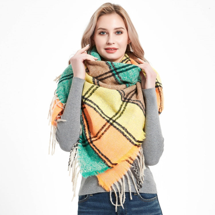 Fringed plaid square scarf in teal, tan, and orange checks with long tassels