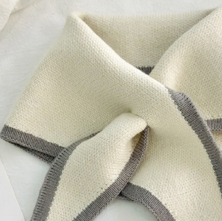 Knitted cream triangle scarf with gray border stripes and soft loop finish
