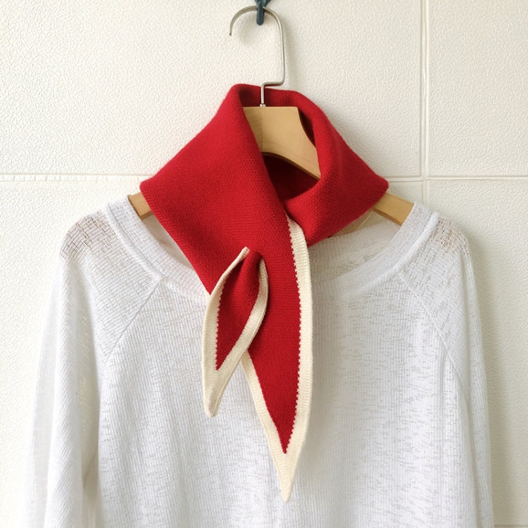 Red and cream knitted wool triangle scarf with striped edges, tied at neck