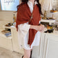 Rust orange knitted triangle shawl scarf with leather buckle strap