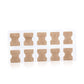 Set of toe nail correction patch stickers on clear sheet, beige patches in a grid
