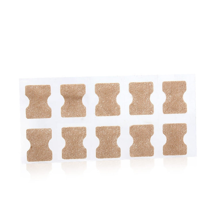 Set of toe nail correction patch stickers on clear sheet, beige patches in a grid