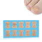 Toe nail correction stickers on blue backing, beige patch squares arranged in rows