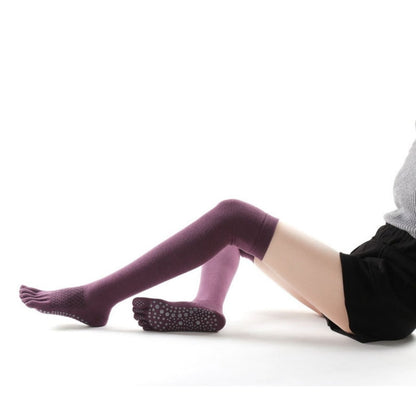 Wine red over-the-knee five-toe yoga socks with anti-slip grip dots on the sole