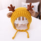 Yellow baby knitted antler hat with pom-pom ears and tie strings, around 46–48 cm