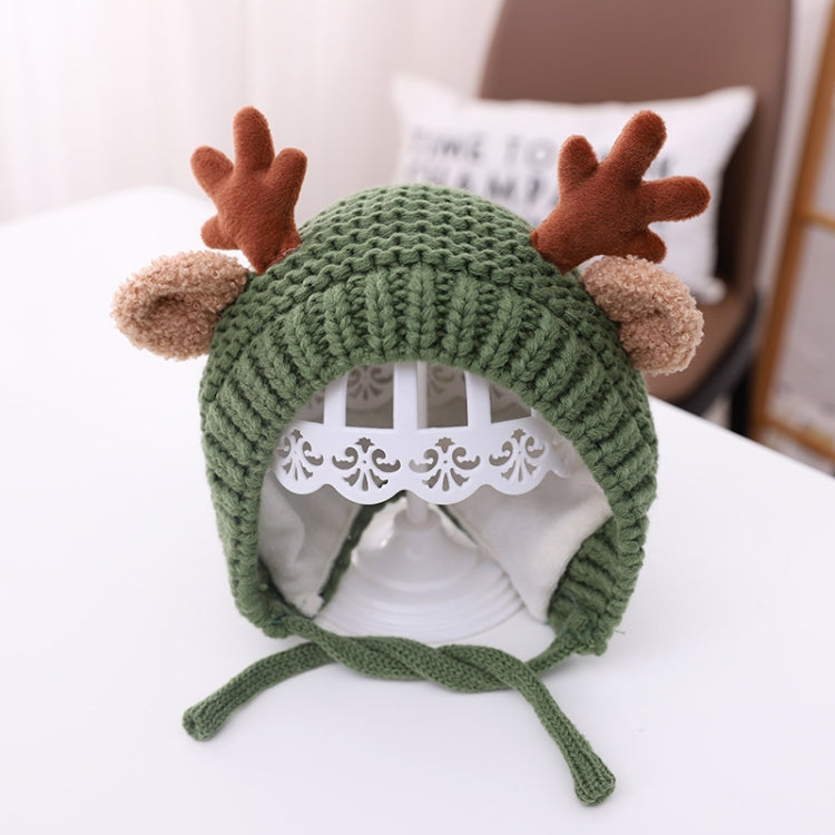 Green baby knitted antler hat with pom-pom ears and tie strings, around 46–48 cm