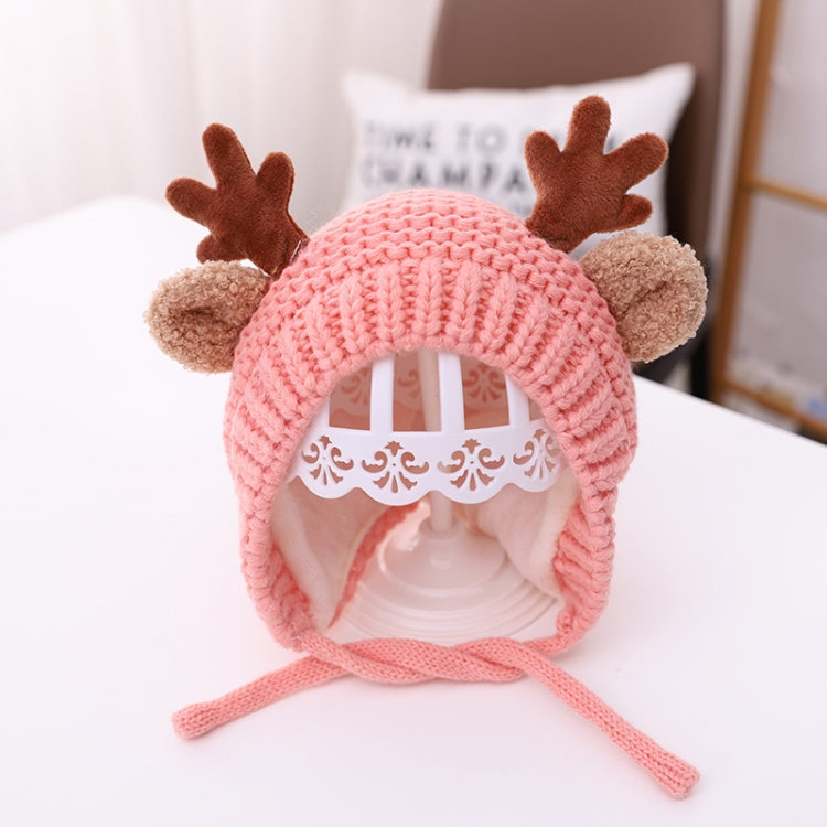 Pink baby knitted antler hat with pom-pom ears and tie strings, around 46–48 cm