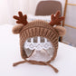 Brown baby knitted antler hat with pom-pom ears and tie strings, around 46–48 cm