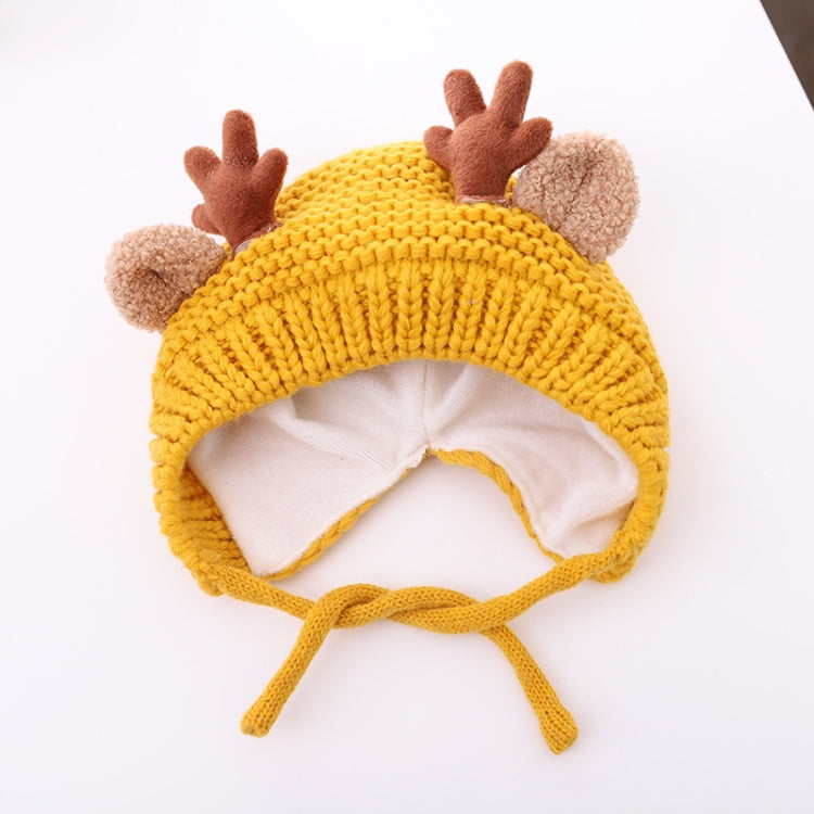 Yellow baby knitted antler hat with pom-pom ears and long tie strings, around 46–48 cm