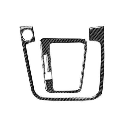 Black carbon-fiber style gear shift panel trim sticker set, two-piece V-shape design.