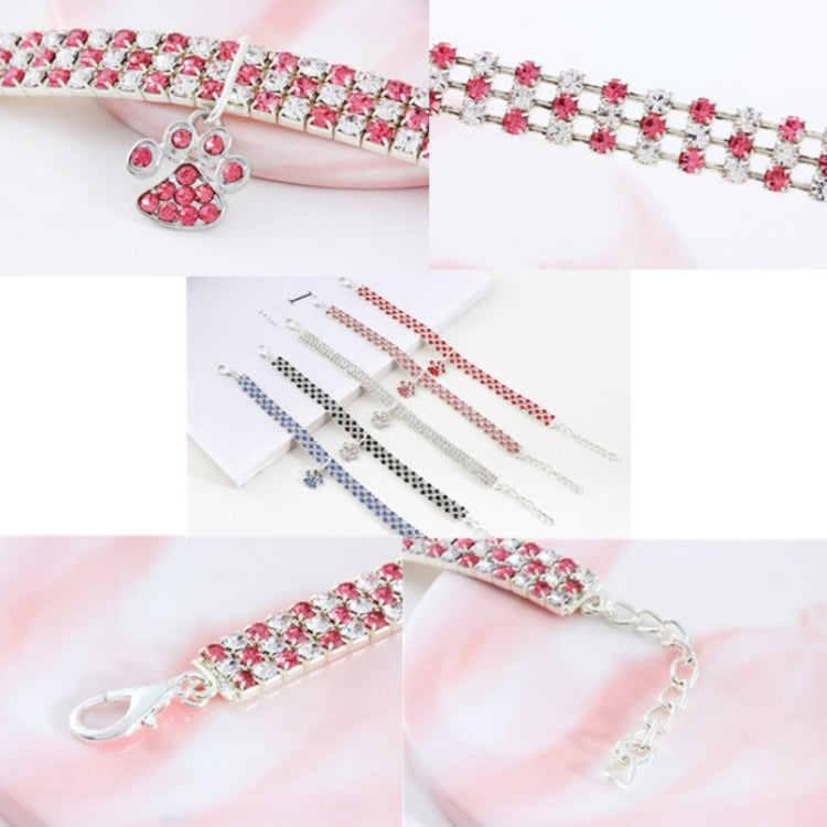 Pink rhinestone pet collar with paw charm and matching crystal chain accessories