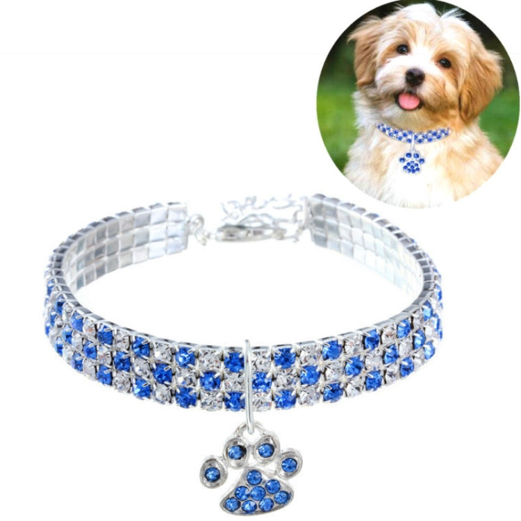 Blue rhinestone pet collar with silver links and blue paw charm with elastic fit