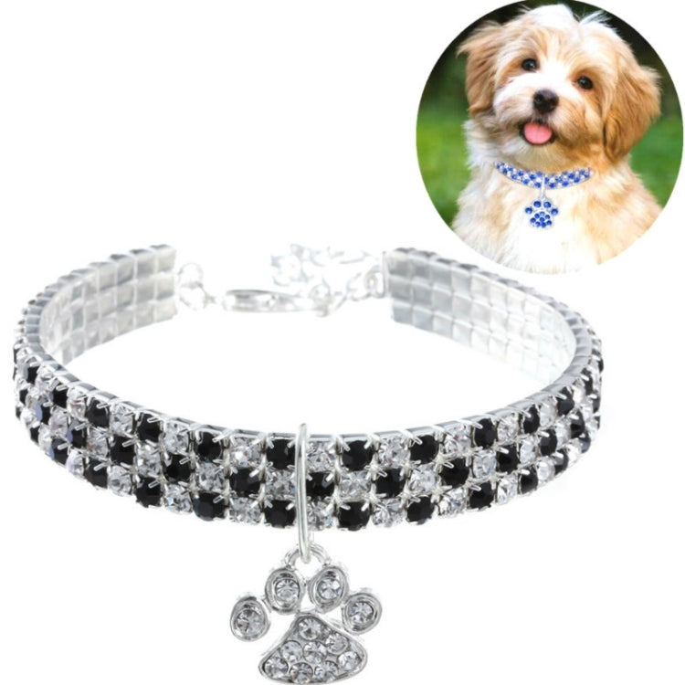 Black and silver rhinestone pet collar necklace with paw charm, shown at an angle