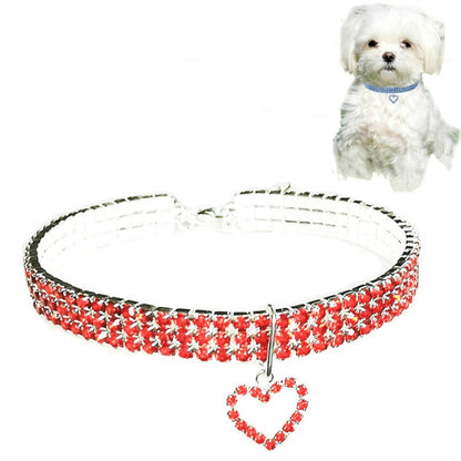 Red jeweled elastic pet collar with heart charm pendant and buckle clasp