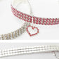 Red rhinestone elastic pet collar with dangling heart charm and front clasp detail