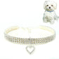 White jeweled elastic pet collar with heart charm pendant and buckle clasp